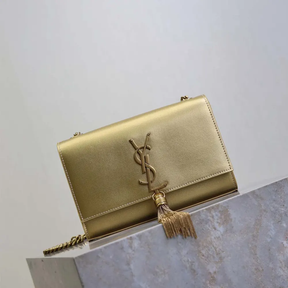 Side angle showing metallic leather shine and compact shape of the Kate Small bag