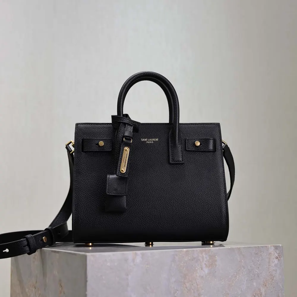 Close-up of gold YSL hardware on Saint Laurent YSL Women Nano Sac De Jour bag