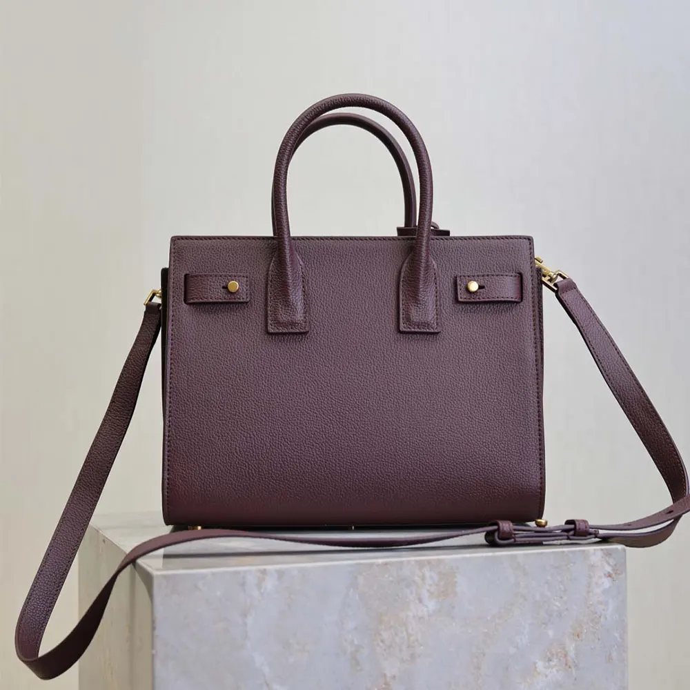 Side profile showing supple grained leather texture on Saint Laurent YSL bag