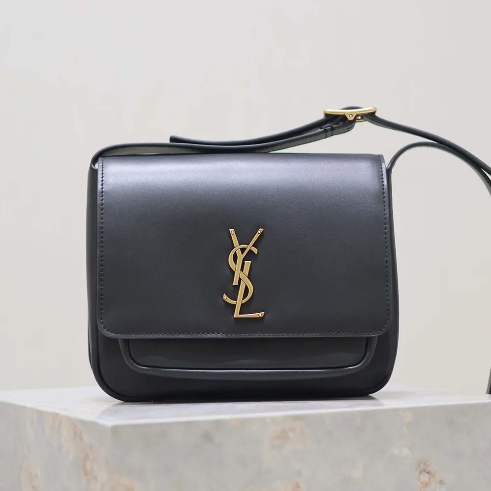 Close-up detail of gold-tone hardware on Saint Laurent YSL Women Niki Satchel