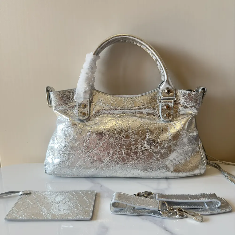 Side angle showing compact silhouette of Balenciaga Women Le City First Bag