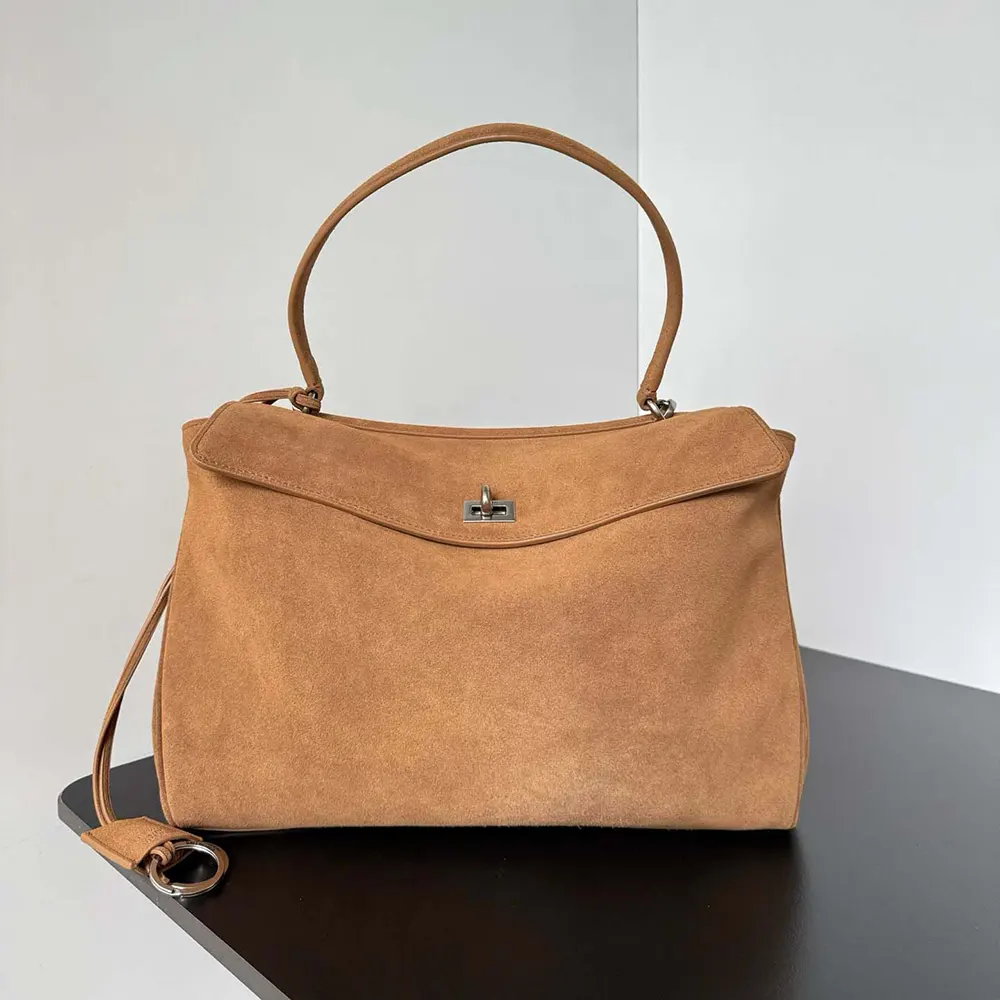 Close-up of gold-tone double-zip hardware on Balenciaga Women Rodeo Handbag
