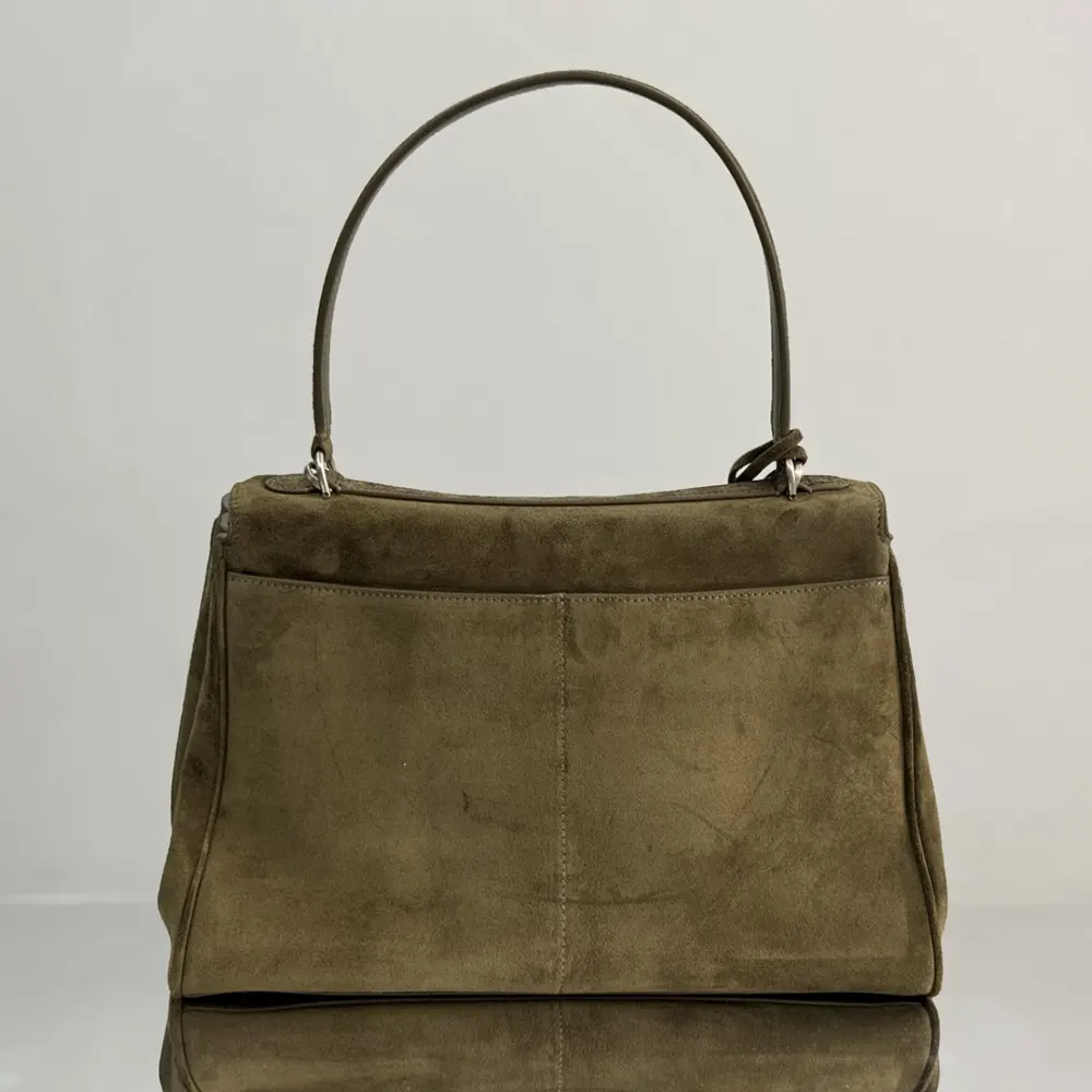 Side angle showing silhouette and textured materials of Balenciaga Women Rodeo Handbag Medium