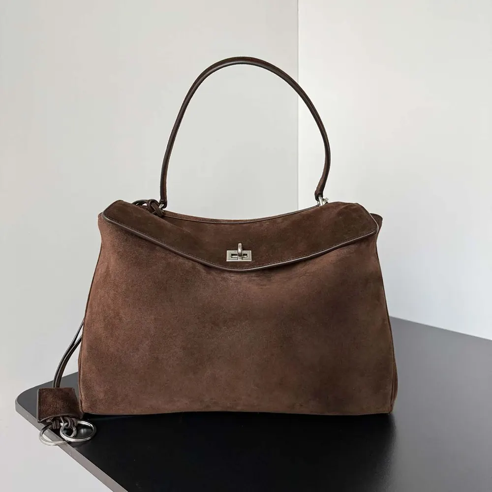 Close-up on antique gold hardware of Balenciaga Women Rodeo Handbag Medium