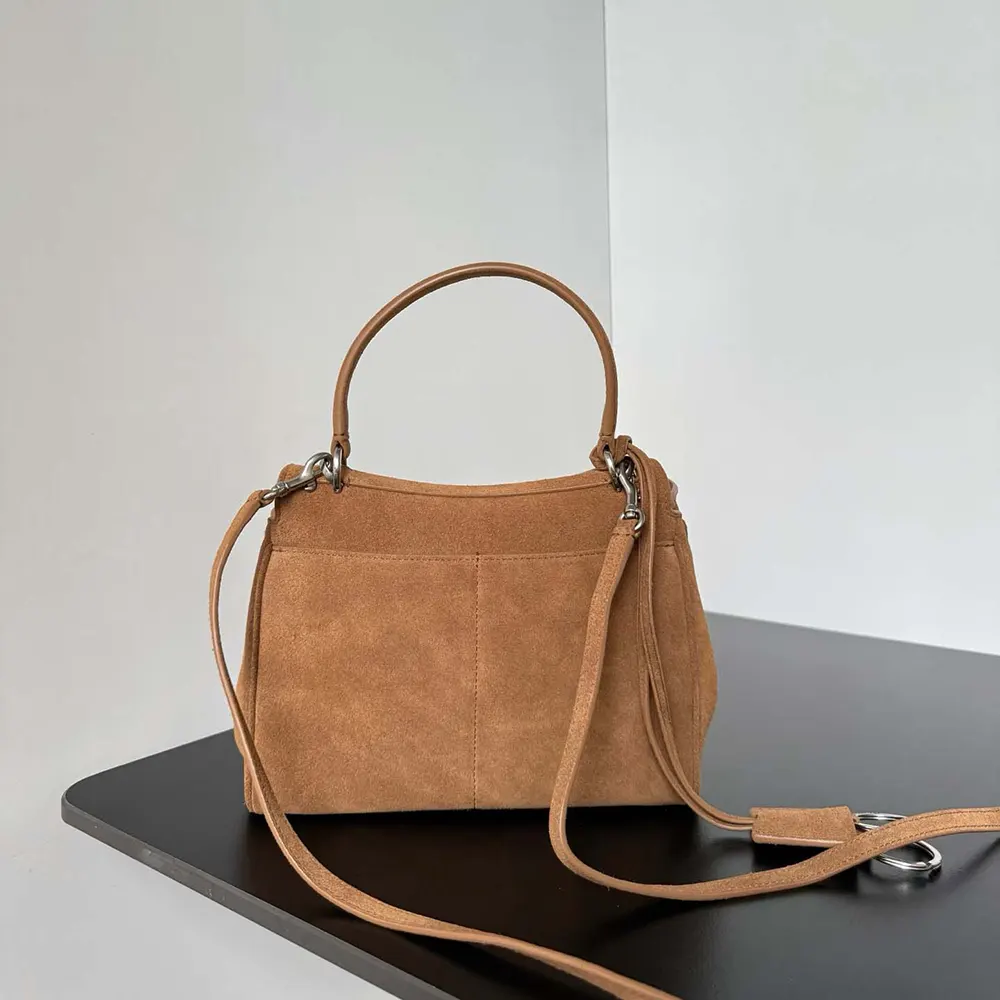 Side angle showing compact silhouette of Balenciaga Women Rodeo Handbag
