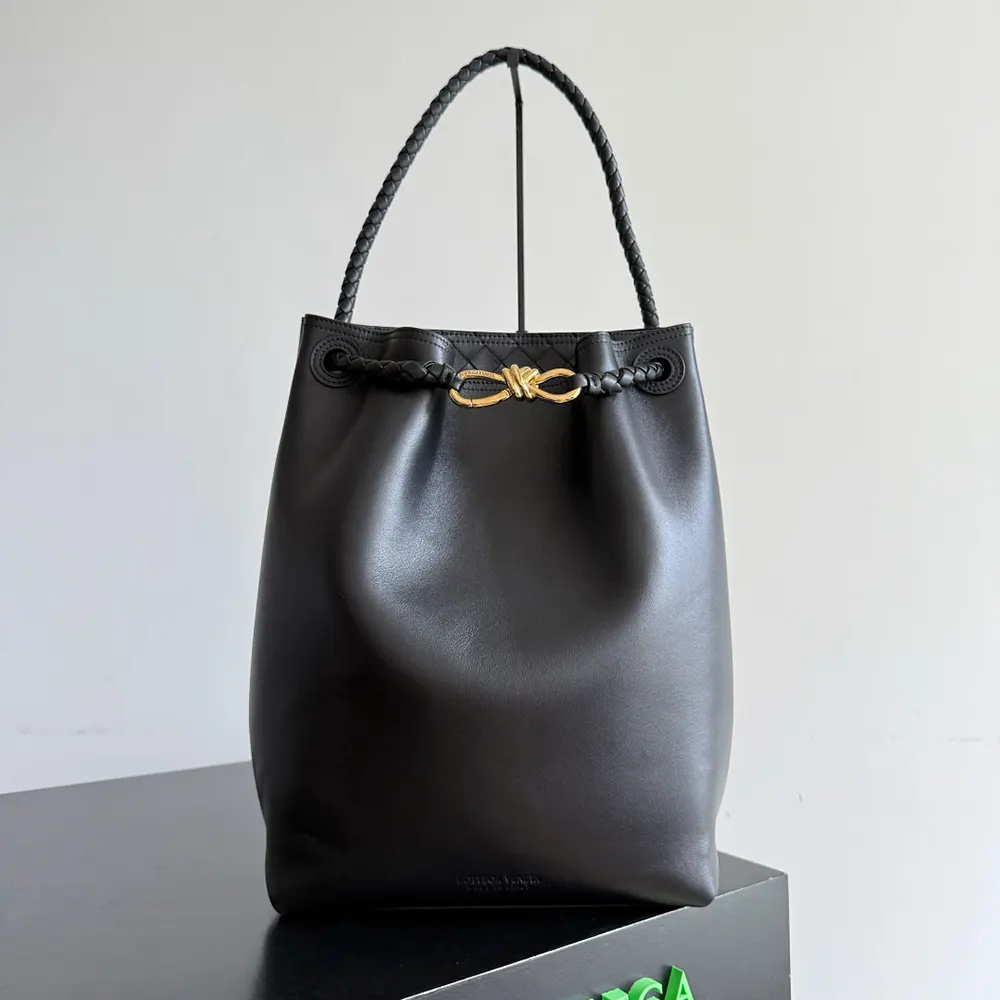 Close-up of gold hardware and magnetic closure on Bottega Veneta Women Andiamo Bucket