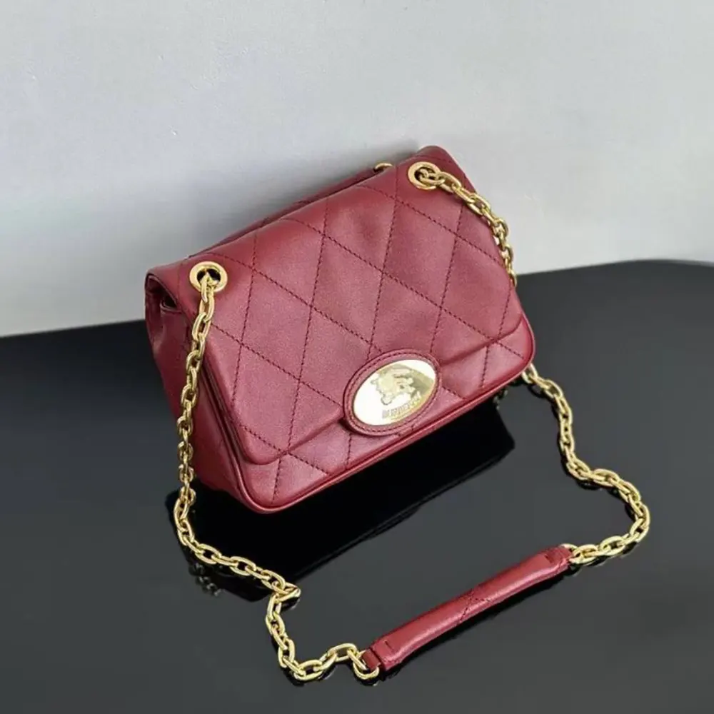 Close-up of quilted leather and gold hardware on Burberry shoulder bag