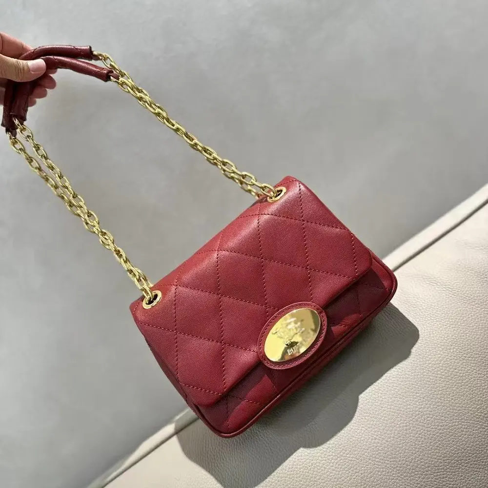 Side angle showing slim profile of Burberry Small Strand Quilted Shoulder Bag