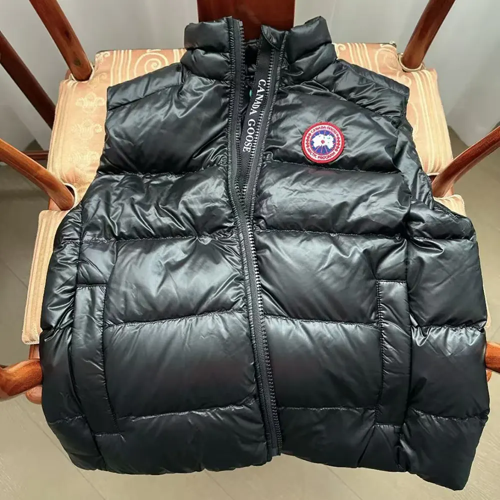 Close-up of zipper and Canada Goose logo on Crofton Vest black fabric