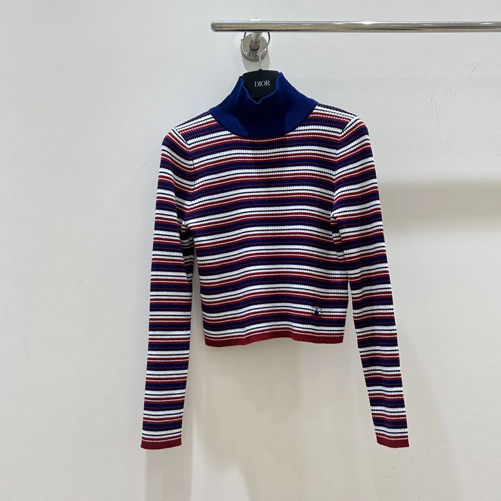 Close-up detail of striped ribbed wool texture on Celine sweater