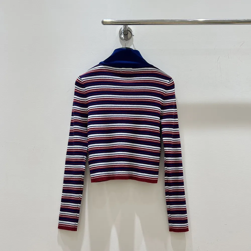 Side angle showing relaxed silhouette of Celine Turtleneck Sweater navy