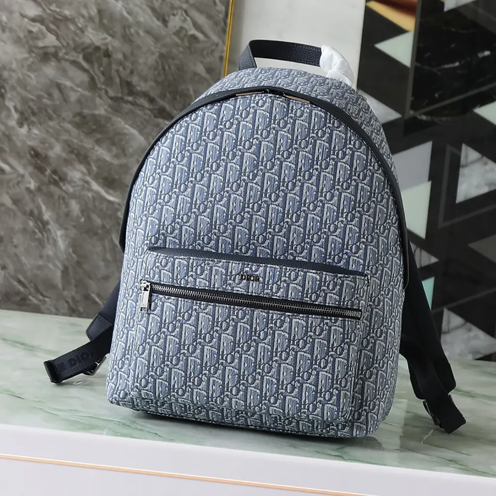 Close-up of blue Dior Oblique jacquard texture on Dior Men Rider Backpack