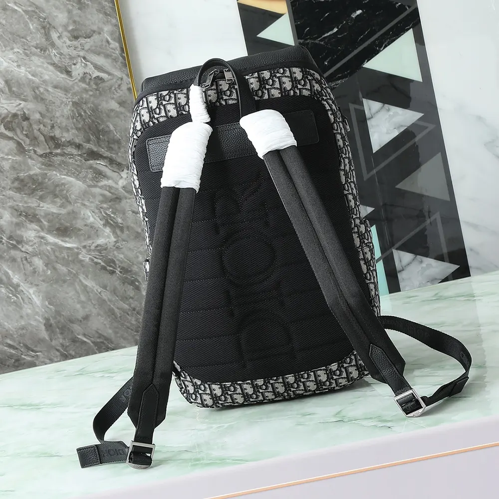 Side view highlighting adjustable straps on Dior Men Rider Soft Zipped Backpack