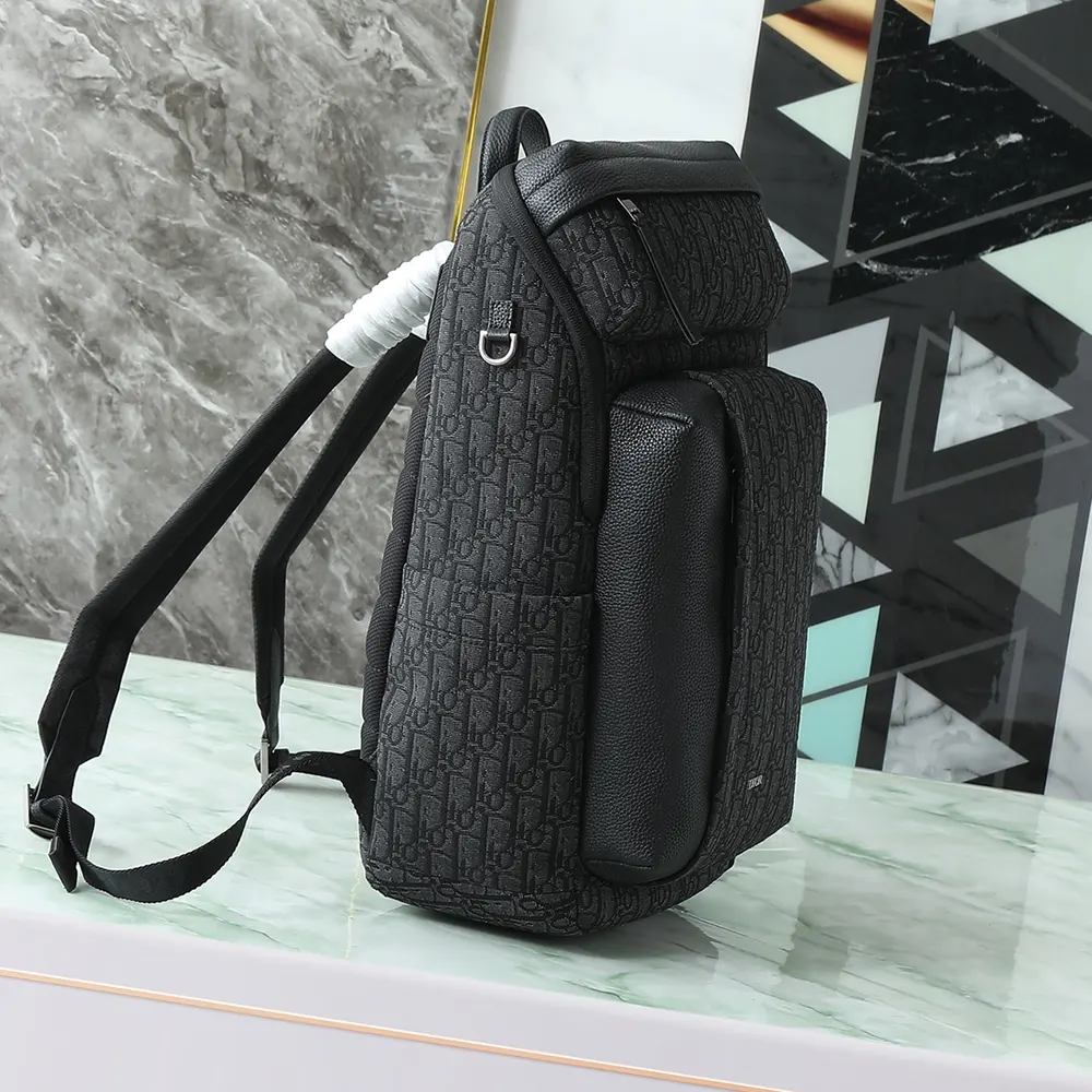 Side profile showing zipped closure on Dior Men Rider Soft Zipped Backpack in black