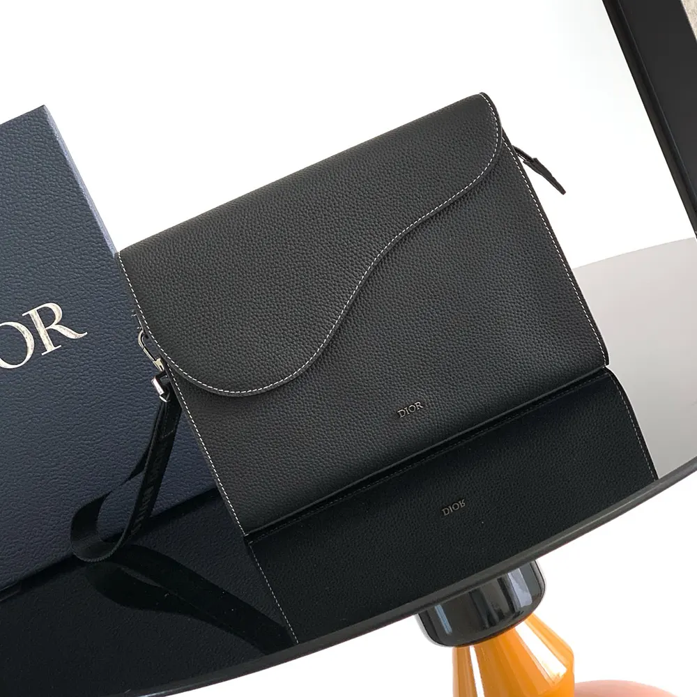 Close-up of silver-tone Dior zipper and logo detail on triangle pouch