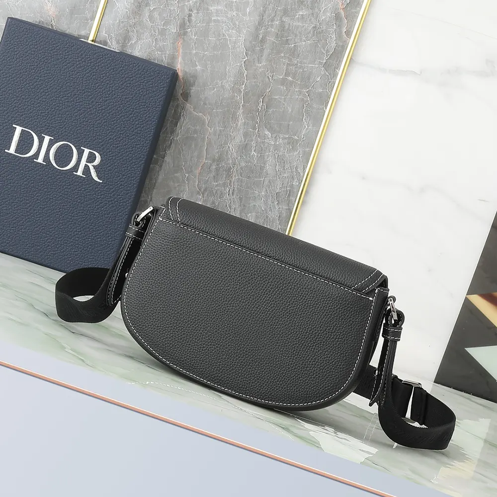 Side angle showing polished hardware on Dior Men Saddle Messenger Bag