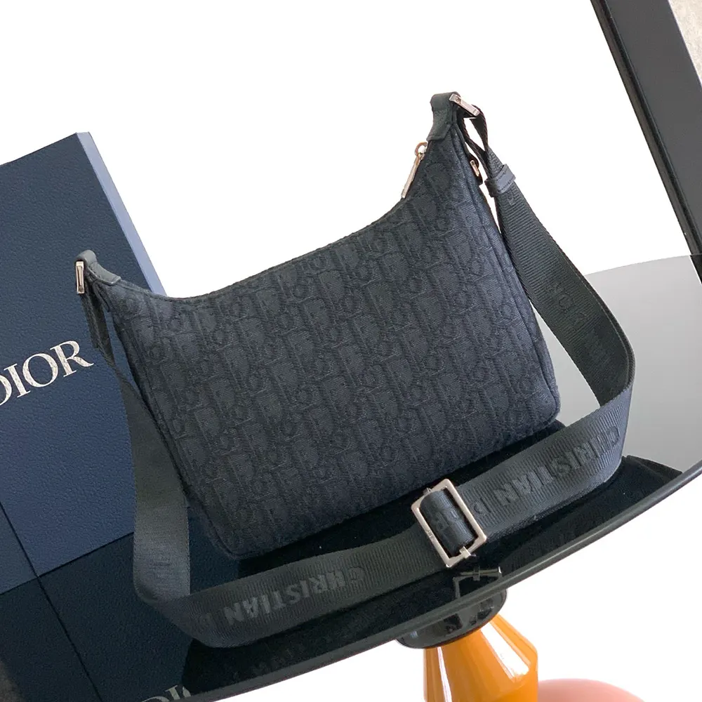 Side angle showing silhouette of Dior Men Small Rider Soft Hobo Bag Black Dior Oblique Jacquard