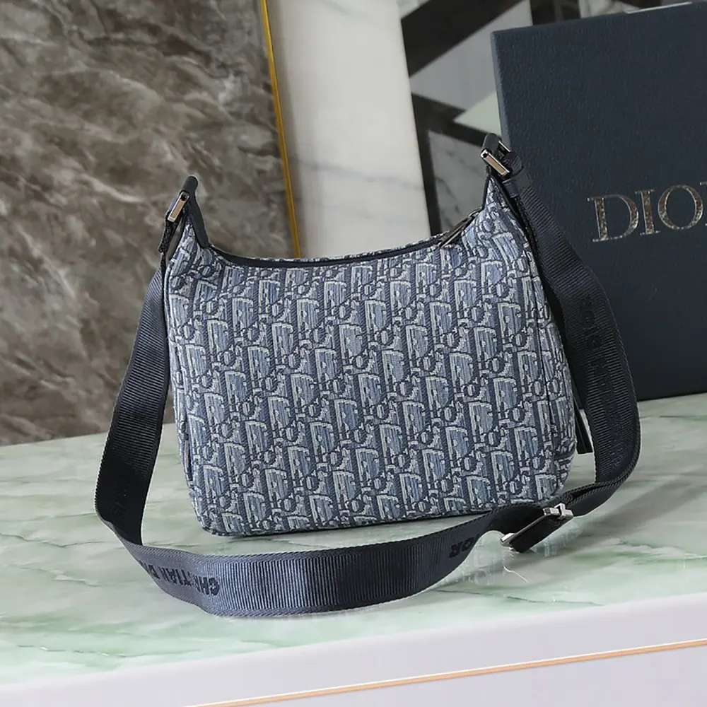Side angle showcasing soft hobo shape of Dior Men Small Rider Soft Hobo Bag
