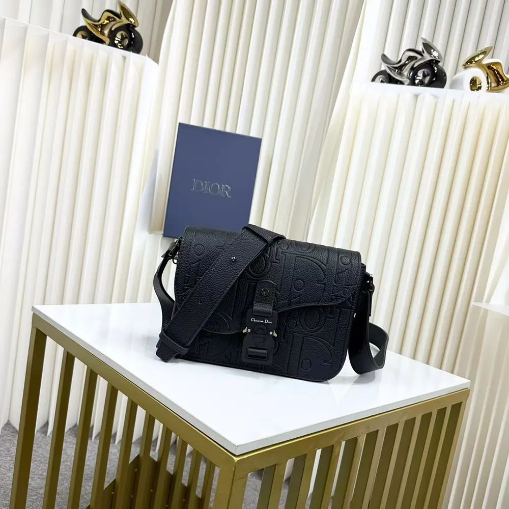 Close-up of flap closure and silver hardware on Dior Men Small Saddle Messenger Bag