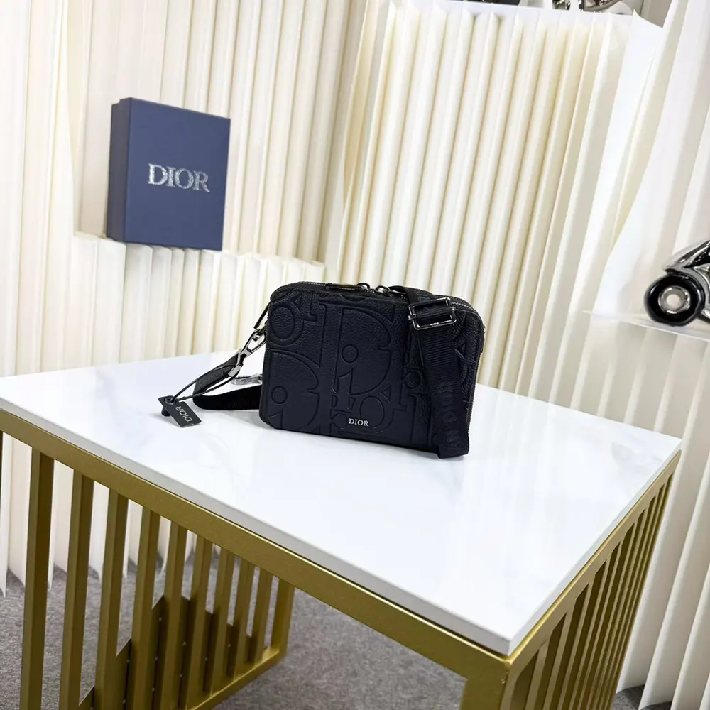 Side angle highlighting leather texture on Dior Men Zipped Pouch with Strap