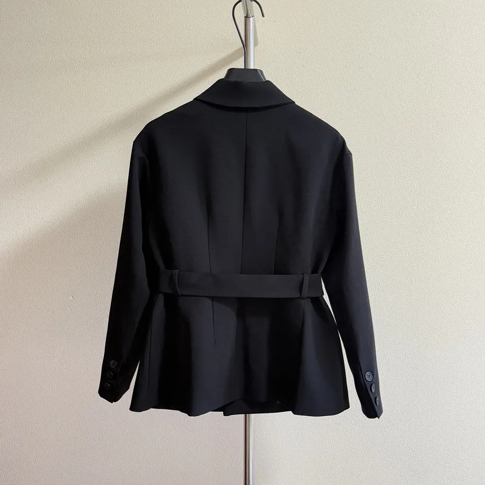 Side angle showing tailored silhouette of Dior Women Belted Jacket