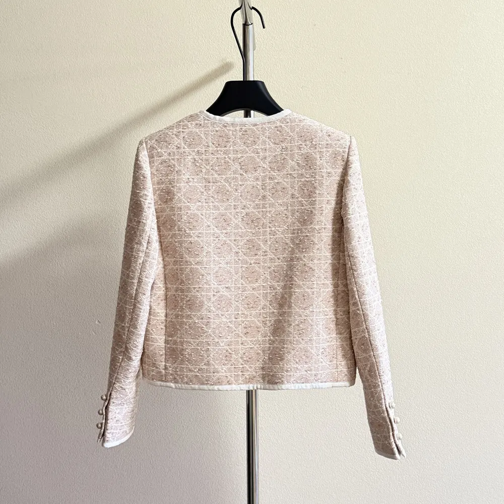 Side angle showing cropped silhouette and fabric texture of Dior cotton-blend tweed jacket