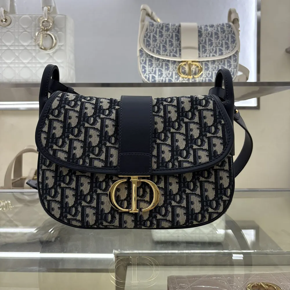 Close-up of silver-tone clasp on Dior Women Medium 30 Montaigne Satchel Bag