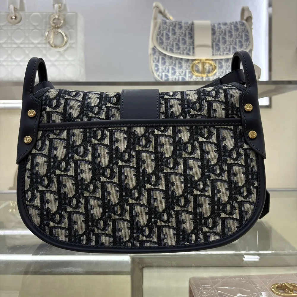 Side angle showing silhouette of Dior Women Medium 30 Montaigne Satchel Bag