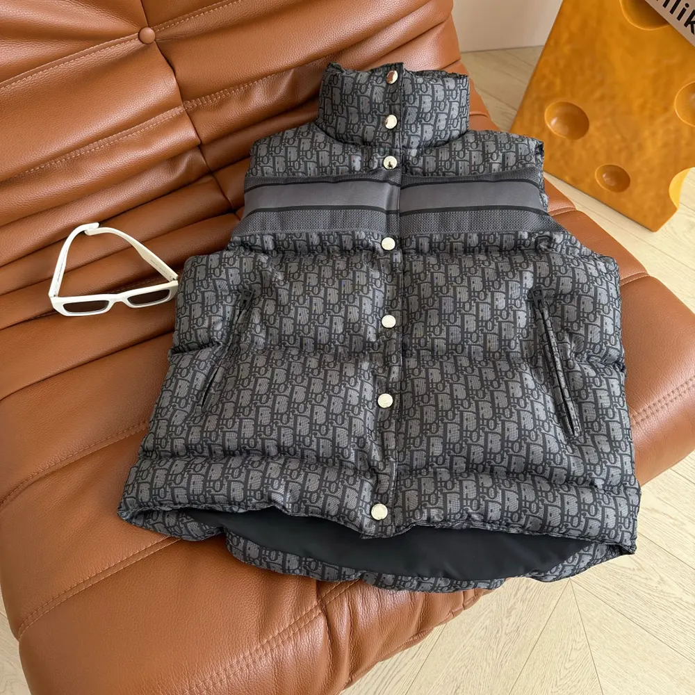Close-up of signature Dior Oblique pattern on black down vest