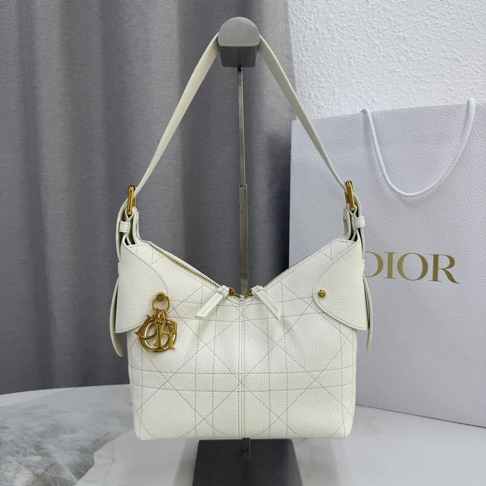 Close-up detail of Macrocannage stitching on Dior Women Small Dior Voyage Bag