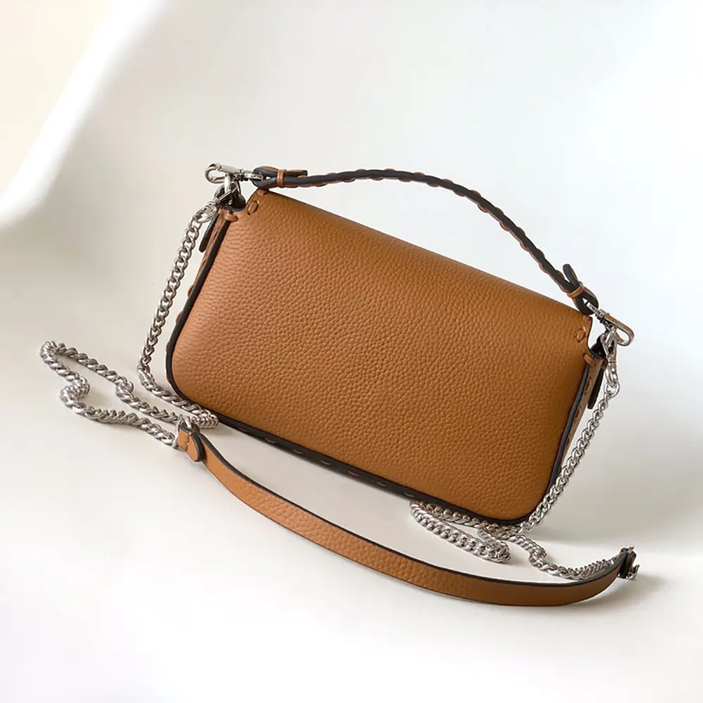 Side profile showcasing gold hardware on Fendi Baguette® Mini Selleria Bag