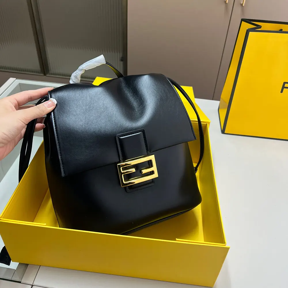 Close-up of gold-tone hardware on Fendi Women Cappuccino Black Leather Backpack