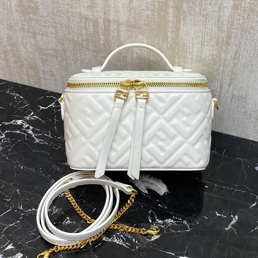 Side angle showing compact silhouette of Fendi Vanity Camelia Mini-Bag
