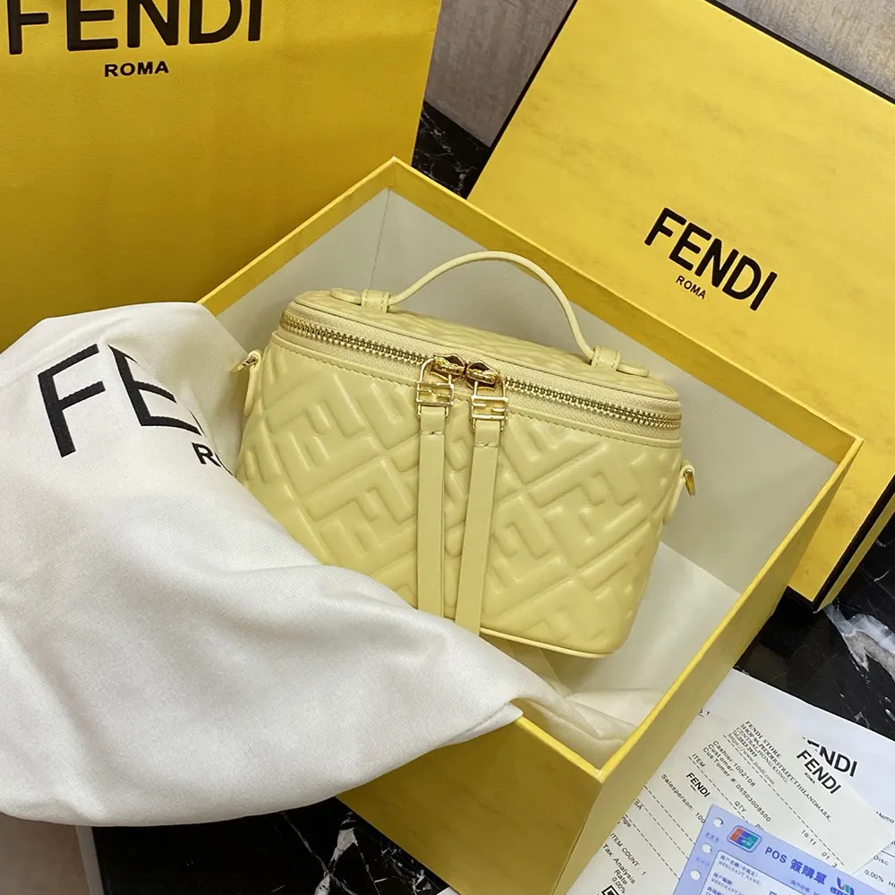 Close-up of gold FF motif on yellow nappa leather mini-bag