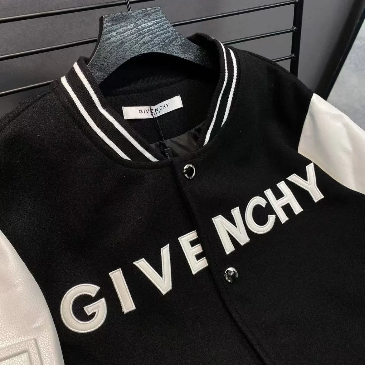 Side angle highlighting zip closure and silhouette of Givenchy Men Hooded Bomber Jacket