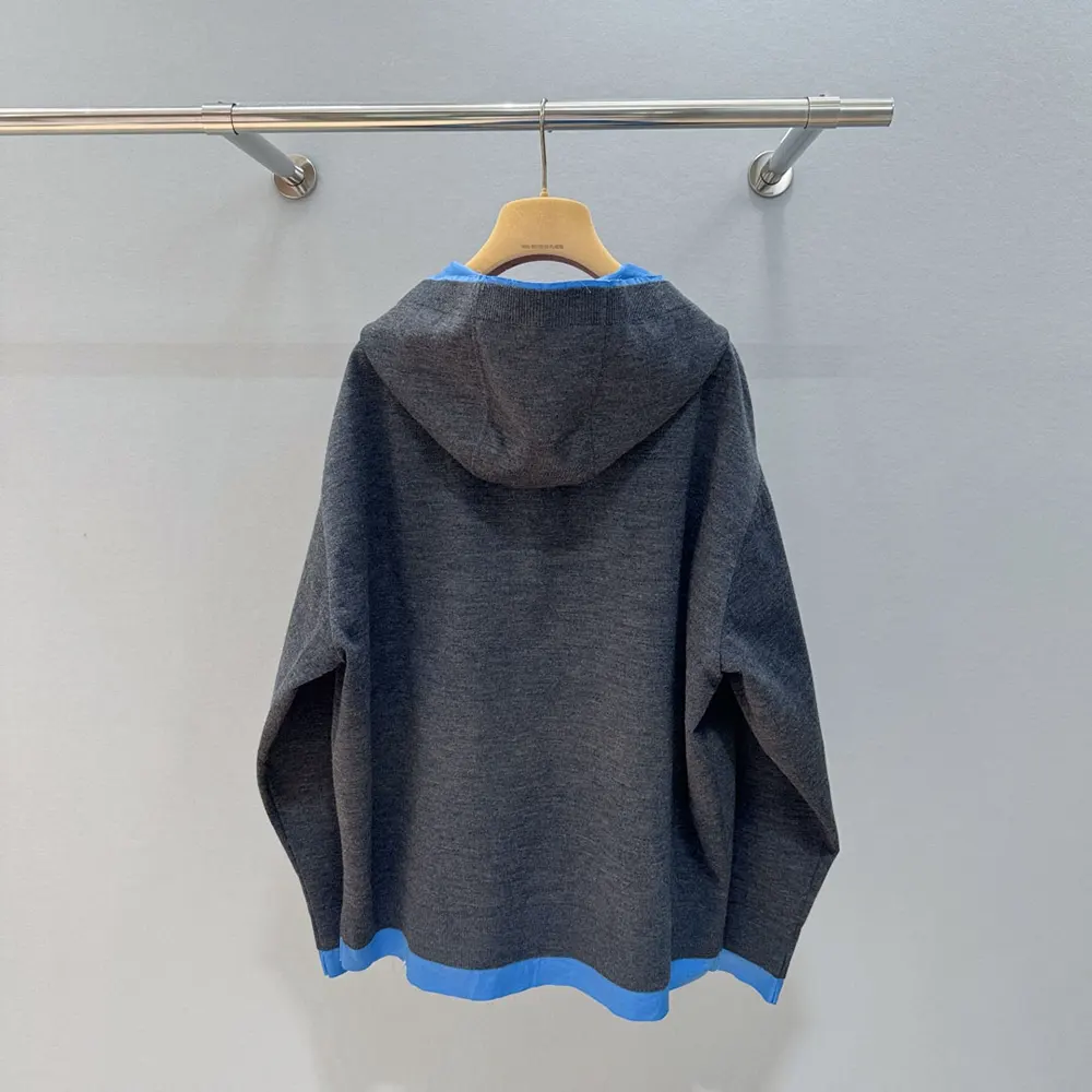 Side angle showing gray bonded knit texture on Miu Miu blouson jacket