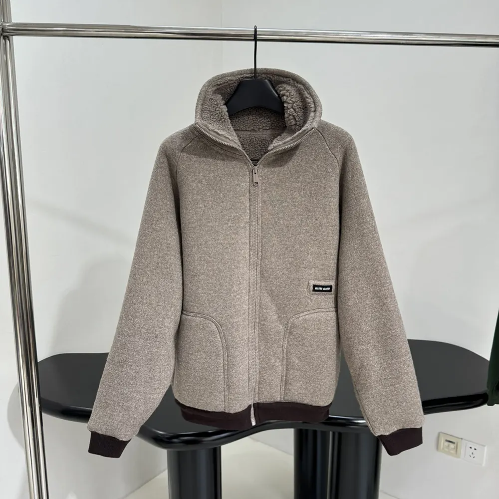Close-up of zipper and branded hardware on Miu Miu cotton fleece jacket