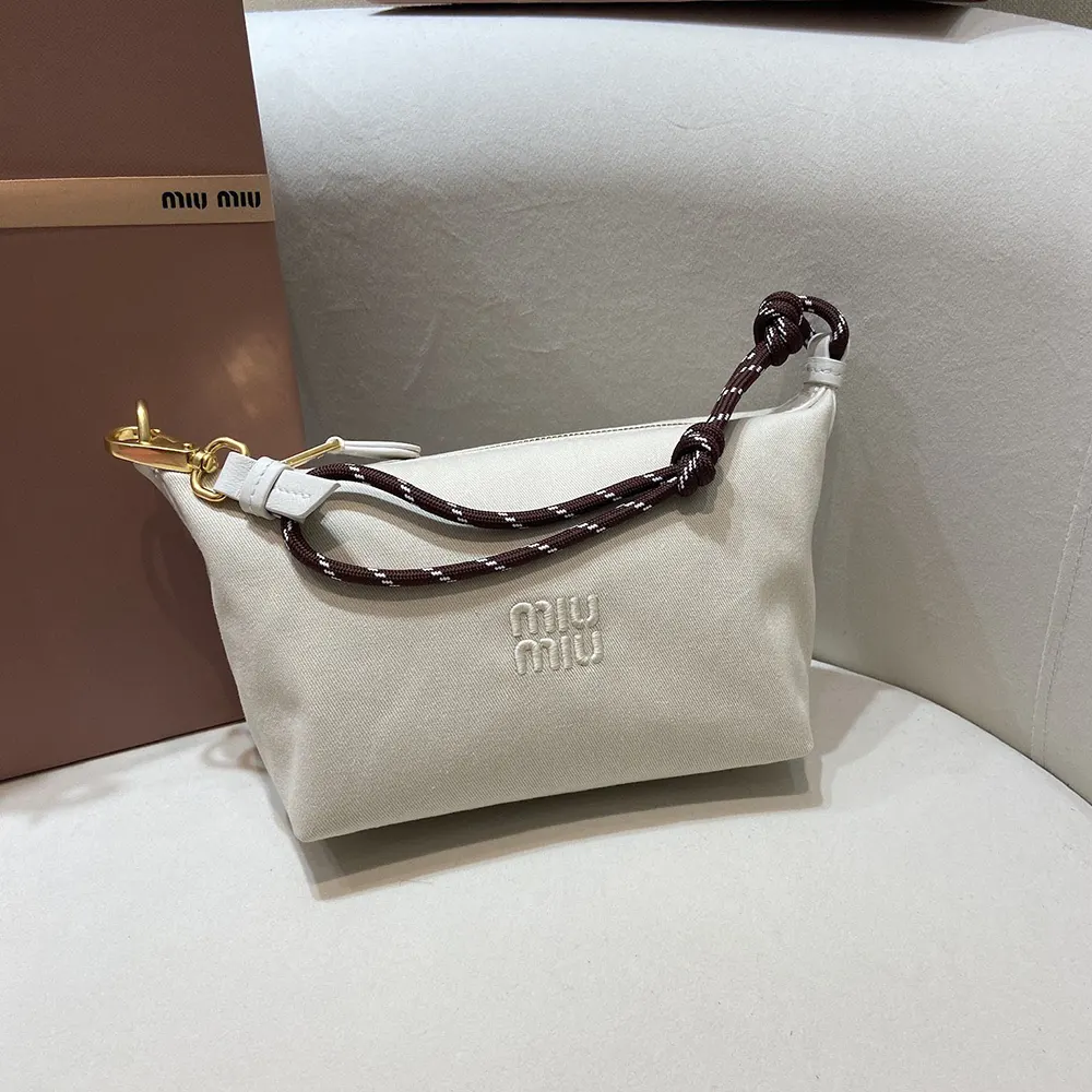 Close-up of silver-tone hardware on Miu Miu Women Gabardine Pouch-White