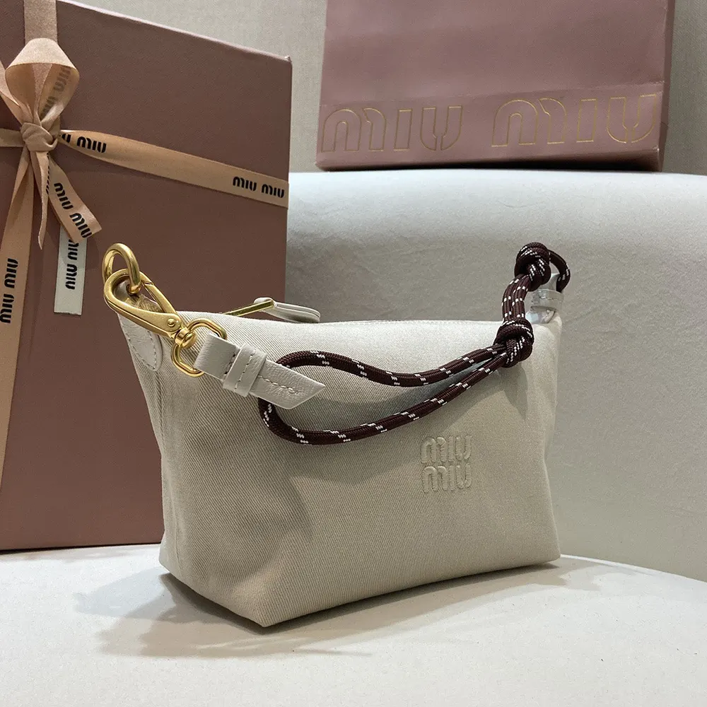 Side angle showcasing the slim silhouette of Miu Miu Women Gabardine Pouch-White