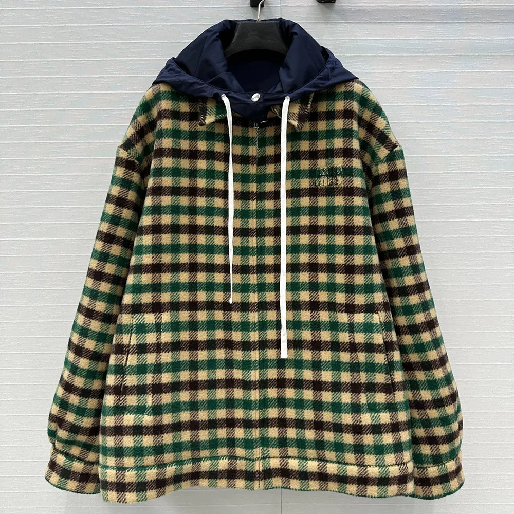 Close-up detail of gingham check and zipper on Miu Miu jacket