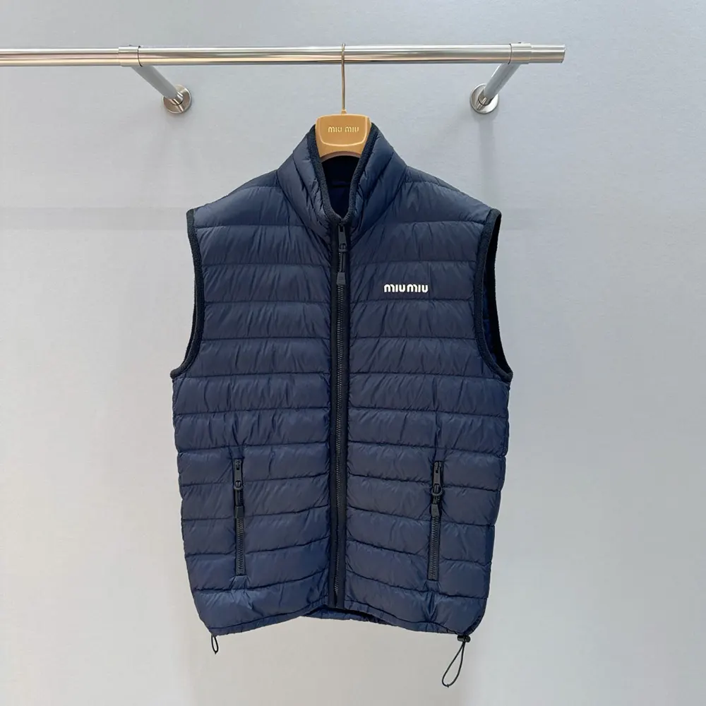 Close-up of embroidered logo detail on navy Miu Miu Women Light Pongé Down Vest
