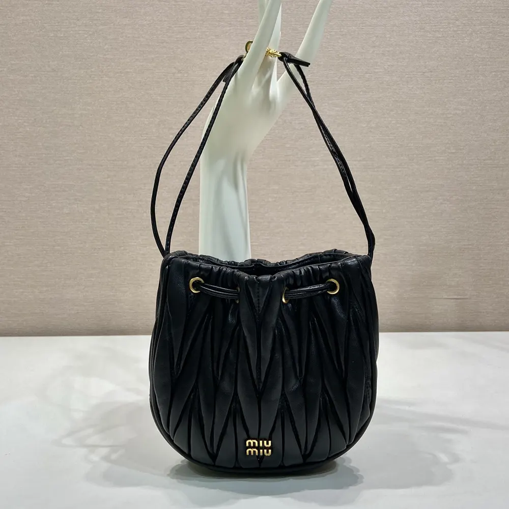 Close-up detail of silver-tone hardware on Miu Miu Women Matelassé Nappa Leather Pouch-Black