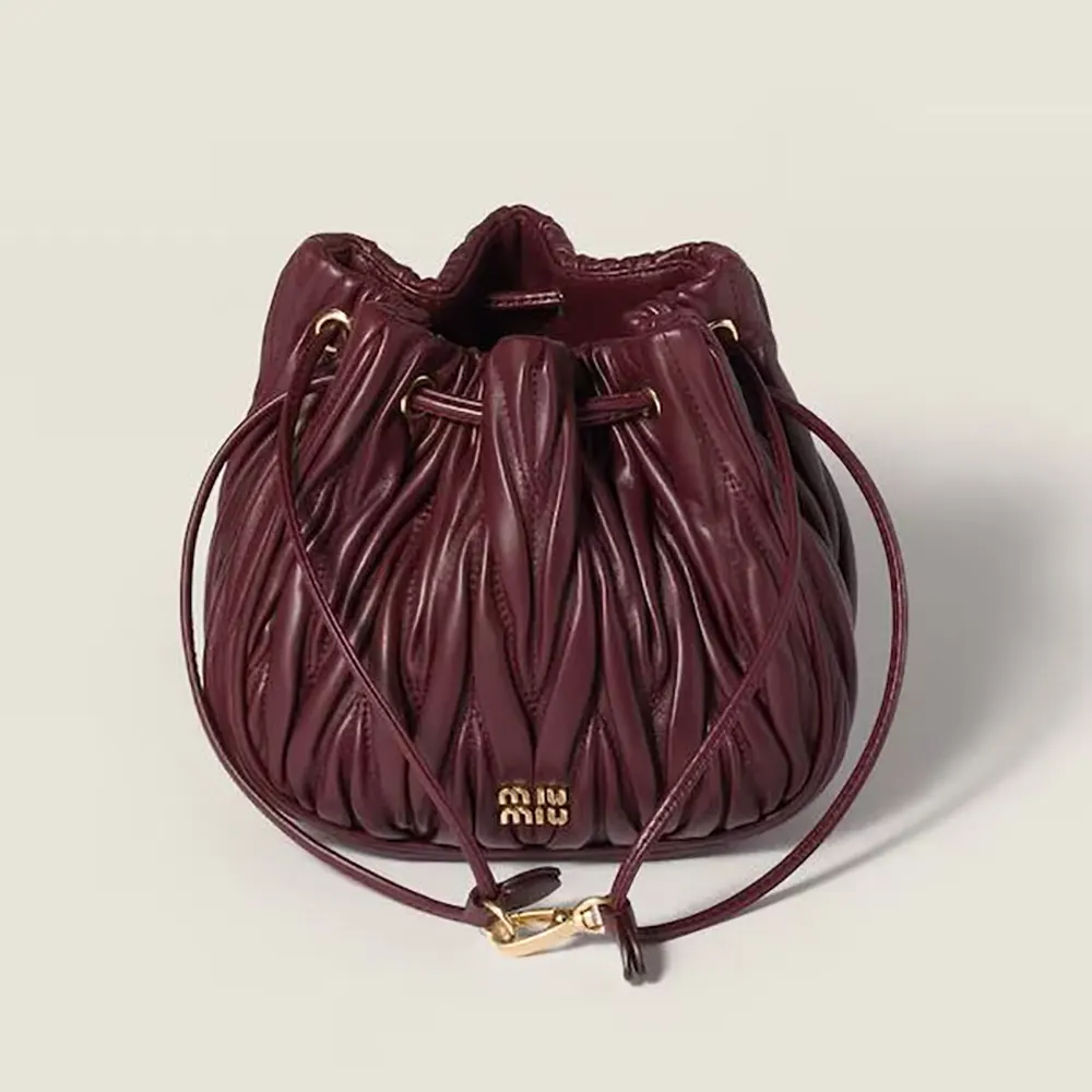 Front view of Miu Miu Women Matelassé Nappa Leather Pouch-Burgundy with zipper closed