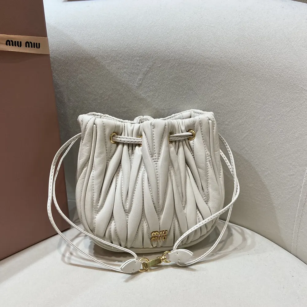 Close-up of silver-tone hardware on Miu Miu Women Matelassé Nappa Leather Pouch-White
