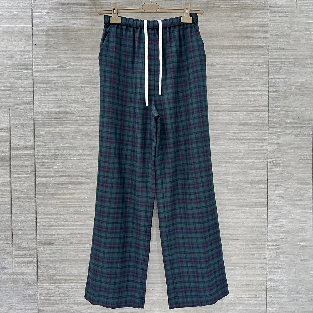 Close-up of embroidered logo detail on Miu Miu Women Plaid Pants