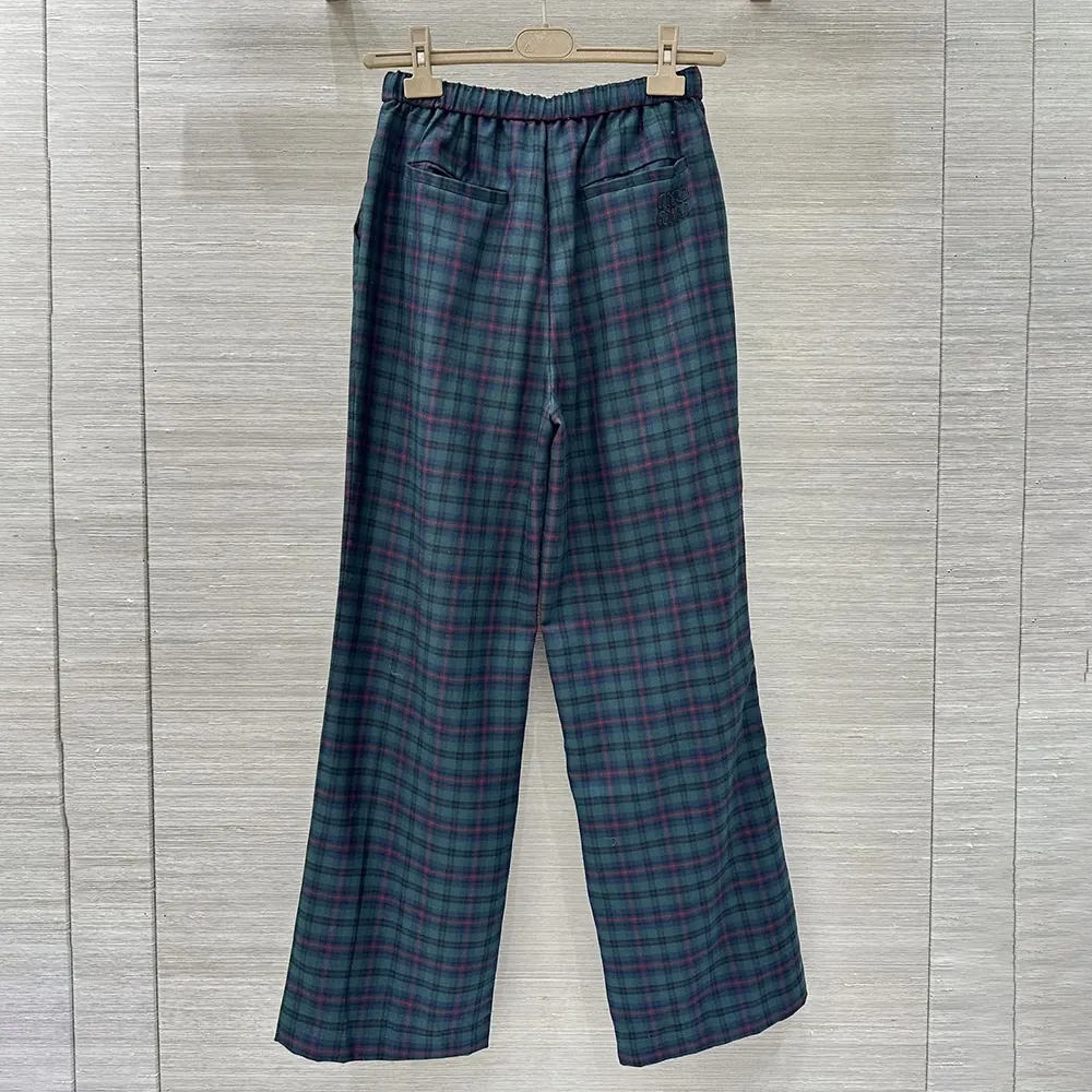 Side profile showing slim silhouette of Miu Miu Women Plaid Pants navy