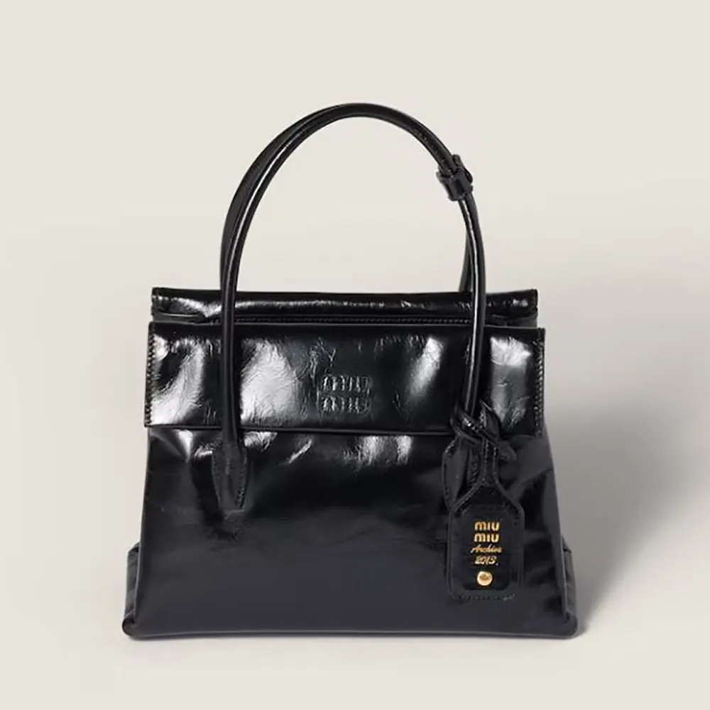 Front view of Miu Miu Women Solitaire Shiny Leather Bag-Black with flap closed