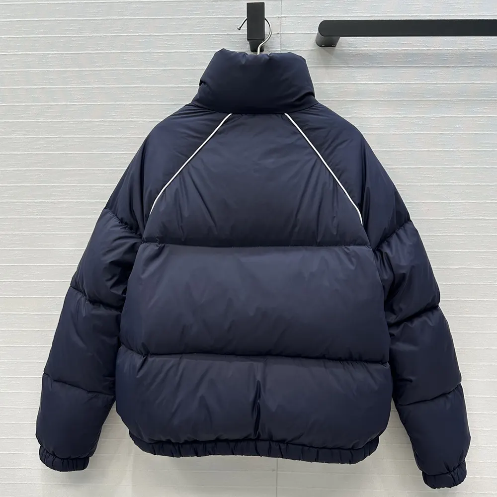 Side profile highlighting the relaxed silhouette of Miu Miu navy jacket