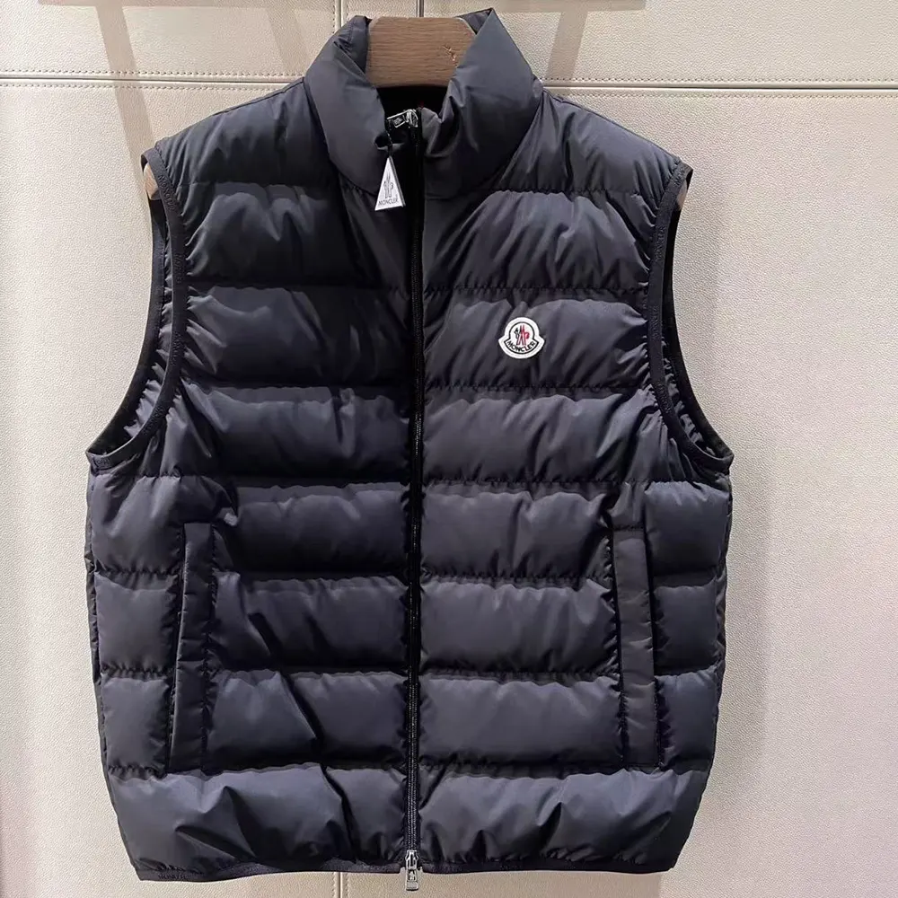Close-up of Moncler logo patch on black Rocoque Down Gilet