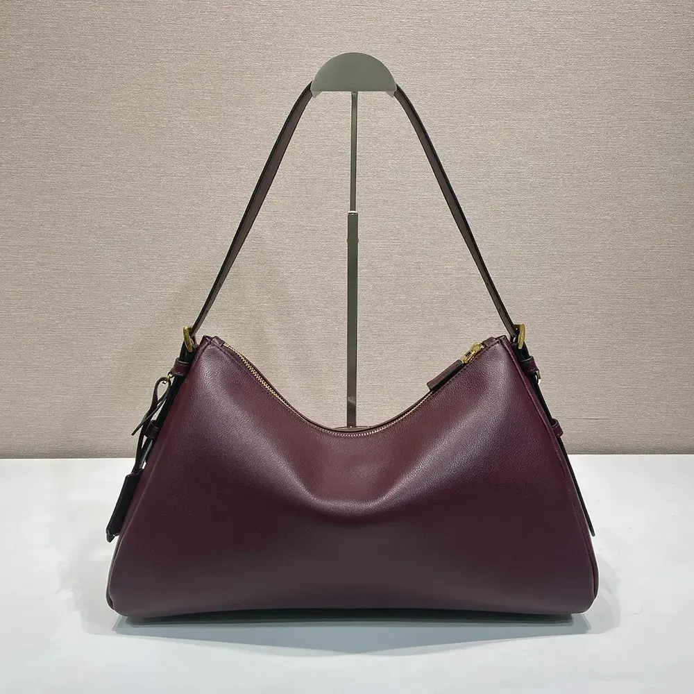 Side angle showing depth of Prada Women Aimée Large Leather Shoulder Bag-Maroon